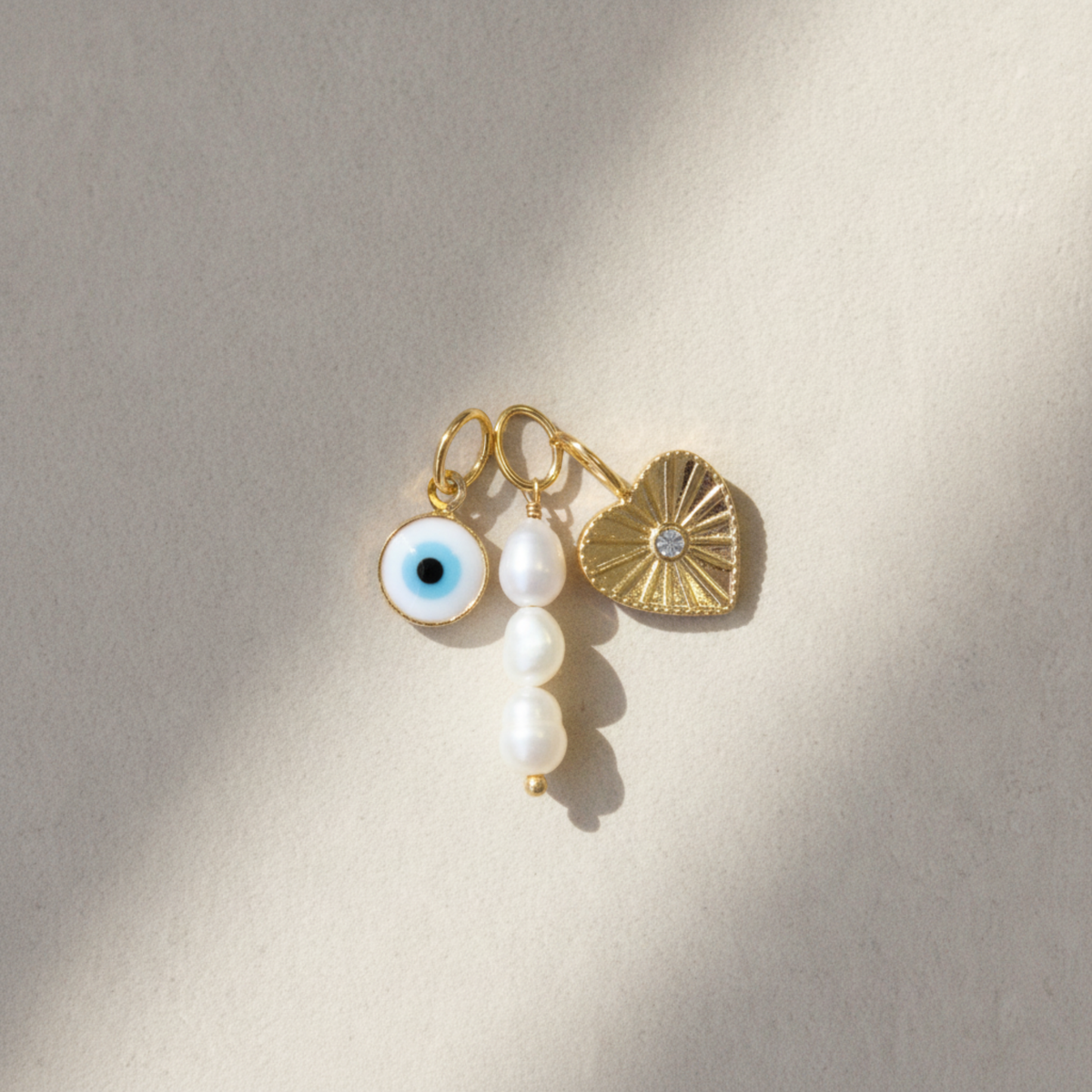 Mix Charm Pérolas + Charm Olho grego + Charm Coração